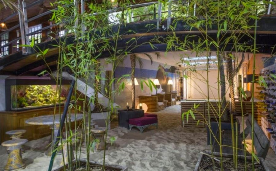A Cut Cost Chalet – The Chalet, Hampton Court Road, East Molesey, Surrey, KT8 9BP – UK’s weirdest home for sale for a sum 61% lower than its 2016 £13m asking price; it has been repossessed and comes with a huge indoor beach – On the market with Savills for £5 million ($6.9 million, €5.6 million or درهم25.3 million) on behalf of LPA Receivers in March 2018; down from £13 million ($17.9 million, €14.6 million or درهم65.9 million) in August 2016.