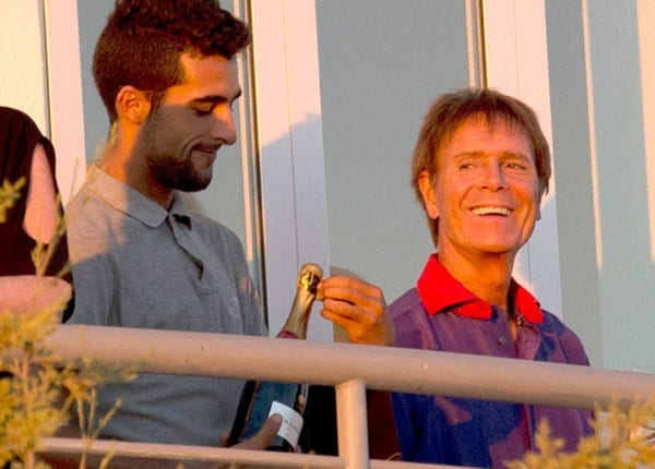 Isn't it a little early for Sir Cliff Richard to be cracking open the champagne?