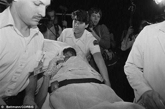 Michael Jackson being wheeled to hospital after the 1984 accident which occured during the filming of a Pepsi commercial