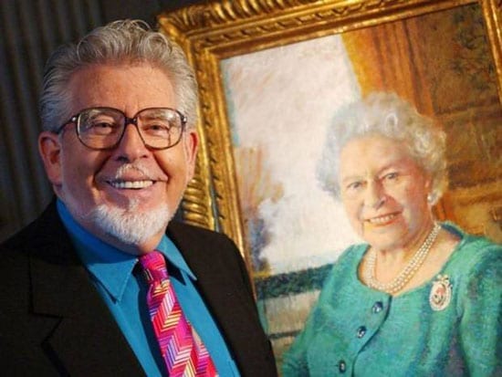 Rolf Harris with his portrait of the Queen
