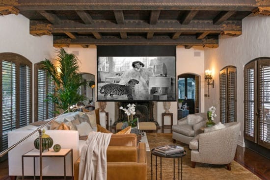 The house's sitting room features a large screen and is the perfect setting to watch movies