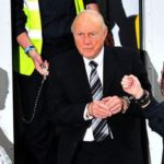 A-handcuffed-Stuart-Hall-arrives-at-Preston-Magistrates-Court-1