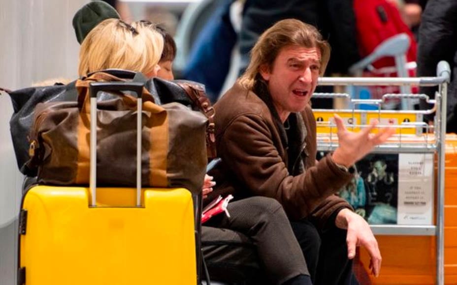 Angry Anth’ – Anthea Turner swings into action to resolve a row with her magic mushroom loving fiancé Mark Armstrong at Heathrow Airport.