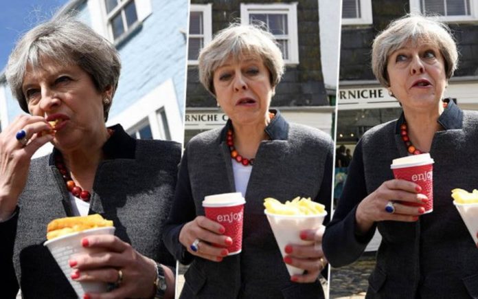Picture of the Week – Chippy May – Awkward Theresa May eats chips