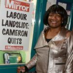 Diane-Abbott-MP-with-a-poster-predicting-something-most-doubt-will-happen-1
