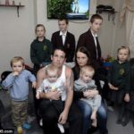 Grasping-duo-Robert-and-Cheryl-Prudham-pose-with-their-brood