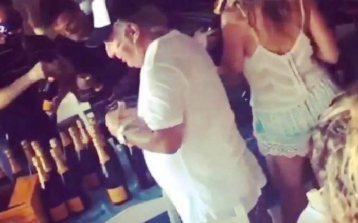 Moron of the Moment – Champagne sprayer Sir Philip Green filmed in debauched incident in Mykonos; he would do better to sip rather than spray his beverages.