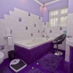 The-bathroom-features-a-bath-surrounded-by-shagpile-and-purple-tiles-even-1