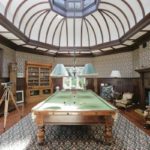 The-billiard-room-has-a-fine-cupola-and-an-Art-Nouveau-fireplace-1