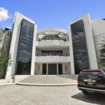The-entrance-to-the-main-residence-has-a-look-of-an-office-building-rather-than-a-home-1