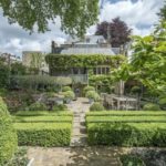 The-house-stands-in-mature-gardens-1