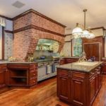 The-kitchen-is-fitted-in-an-equally-masculine-style-and-features-mahogany-units-1