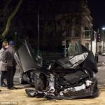 The-owner-of-the-car-surveys-the-wreckage-with-friends