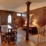 The-paneled-entrance-hall-doubles-as-a-dining-room-1