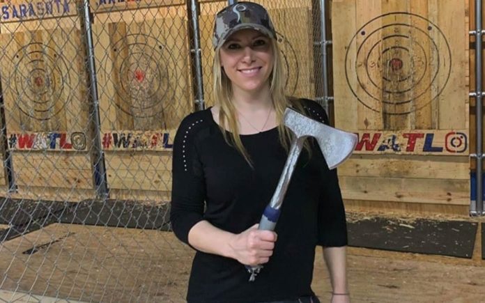 Axing Switlyk – Sex toy loving Larysa Switlyk appears in a video hurling axes at a wall whilst trying to flog ghastly leggings.
