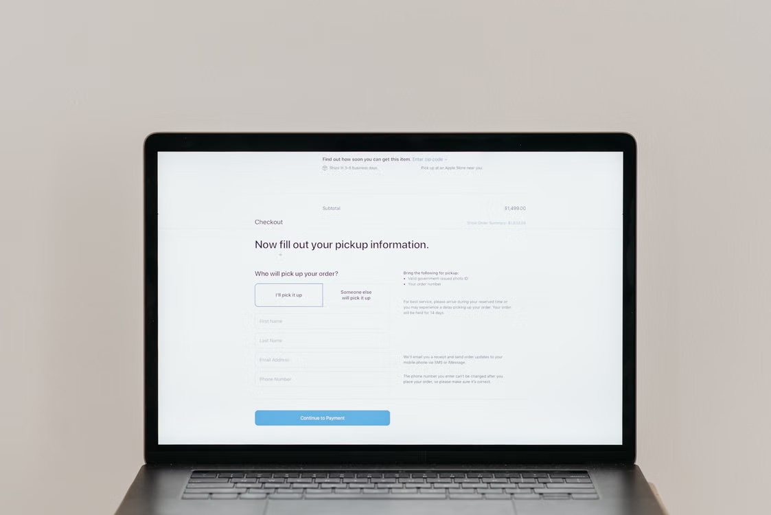 A laptop displaying an online checkout form